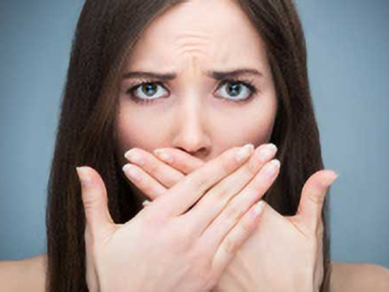 A women hiding her mouth