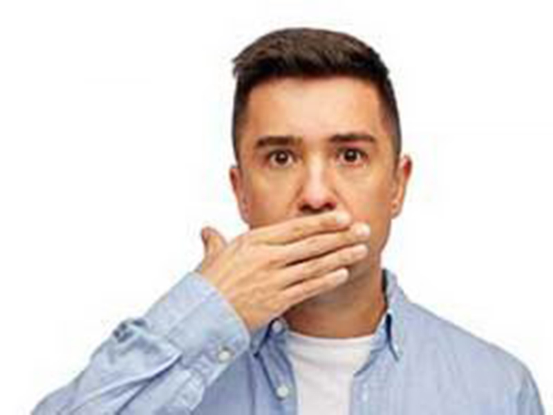 A man hiding his mouth