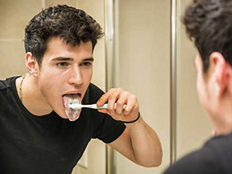 A man brushing his teeth