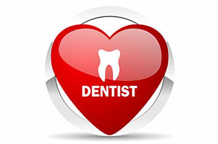 Red heart-shaped button featuring the word "dentist", in Edmonton, AB