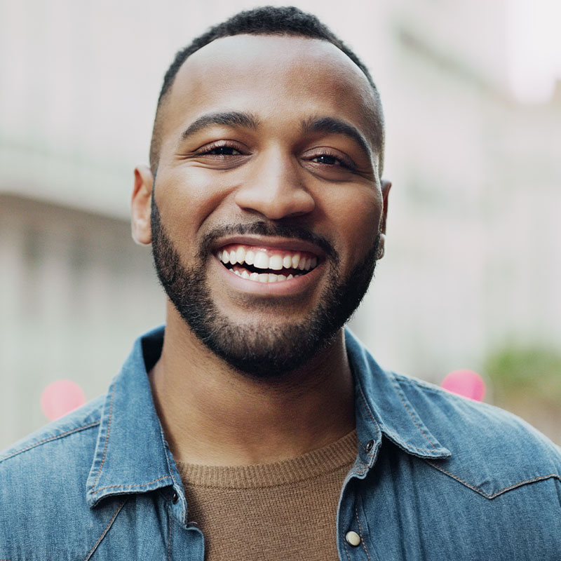 Happy man smiling outdoors