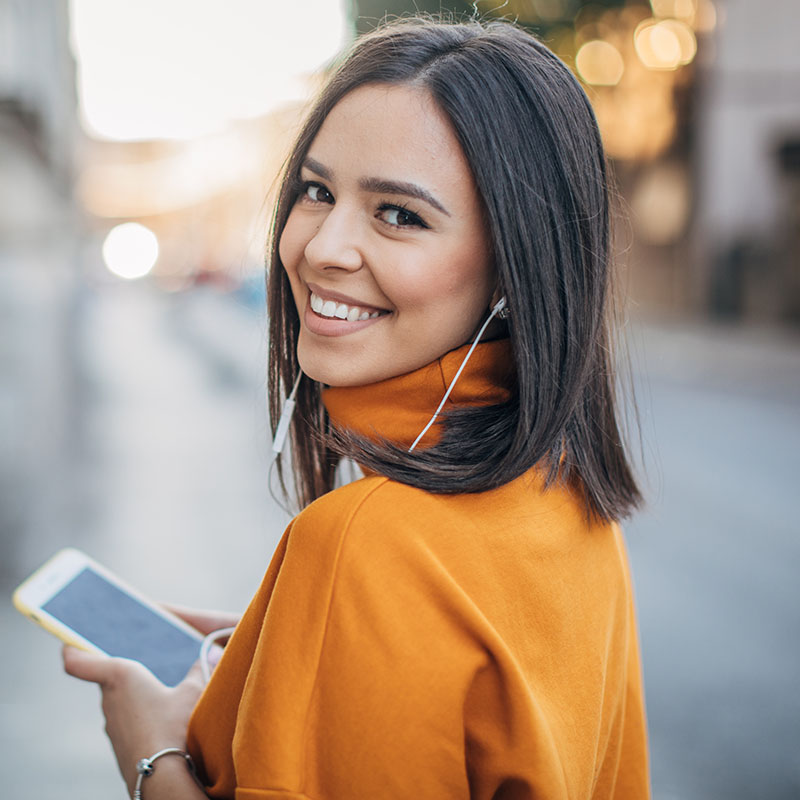 Happy woman smiling outdoors