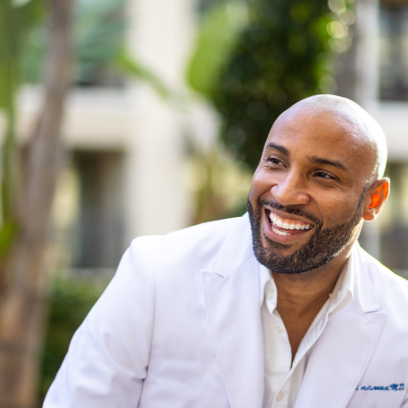 Attractive Black Doctor Smiling Outdoors
