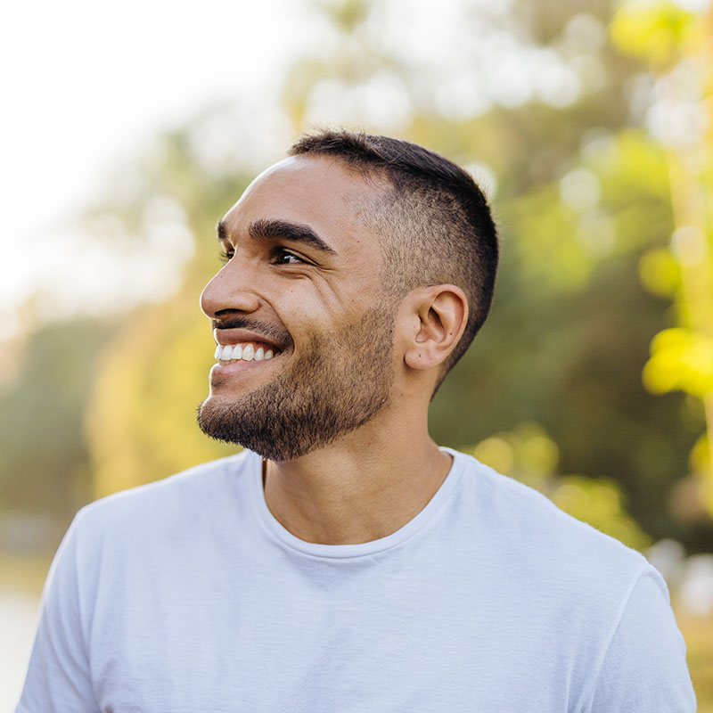 Man smiling outdoors