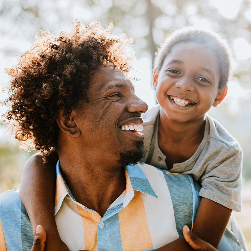 Happy father and son having fun outdoors