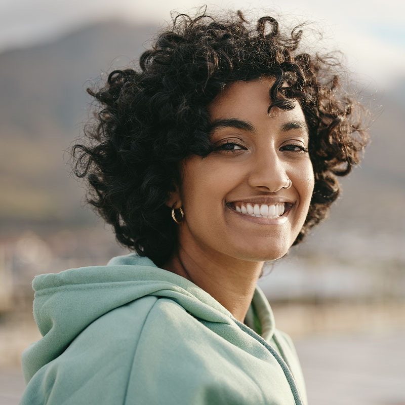 Happy woman smiling outdoors