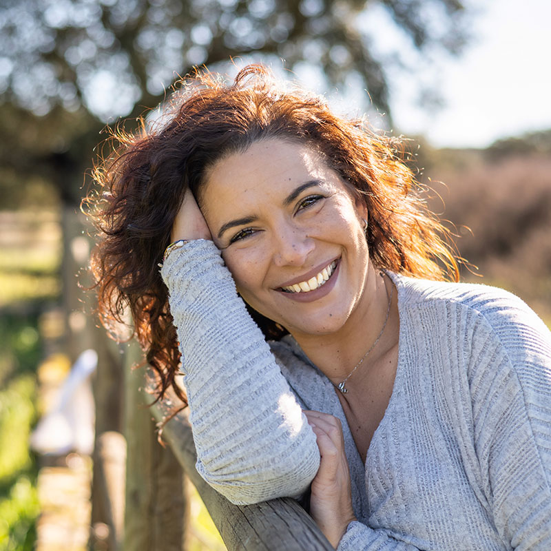Attractive Woman Looking At Camera And Smiling