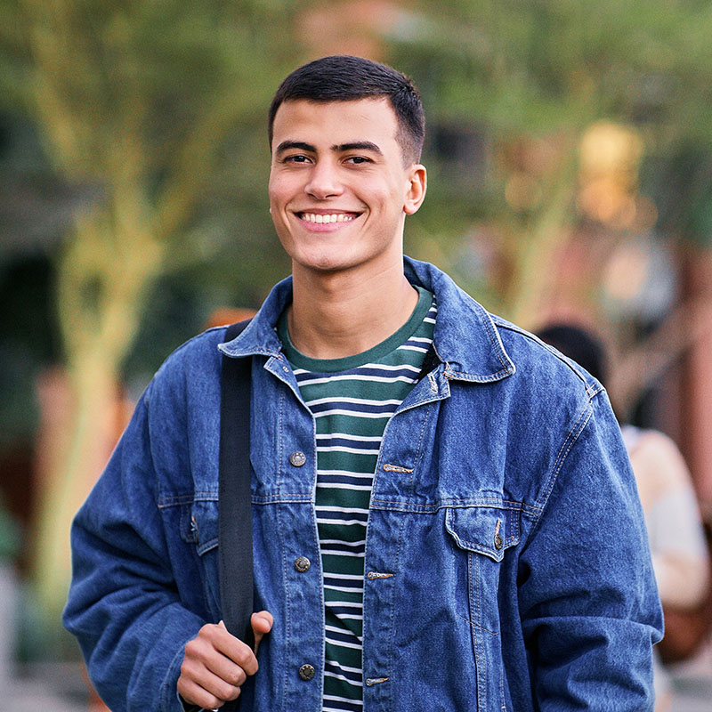 University student on park walk for scholarship