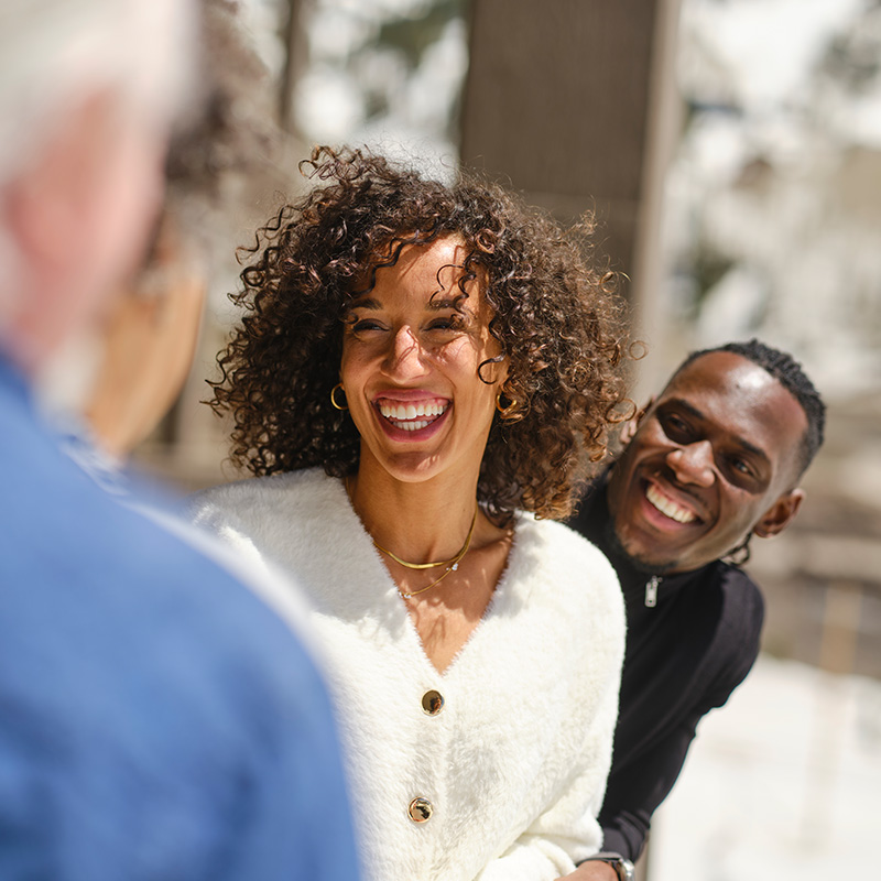 Happy couple smiling outdoors