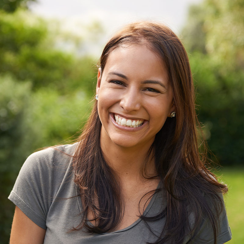 Woman smiling outdoors