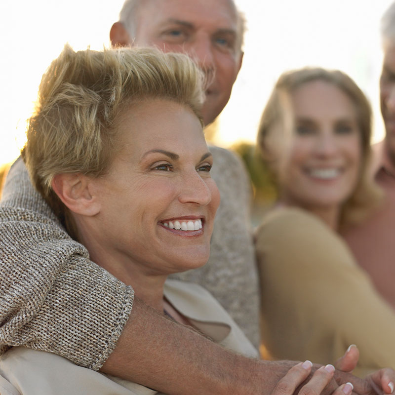 Happy woman smiling with friends
