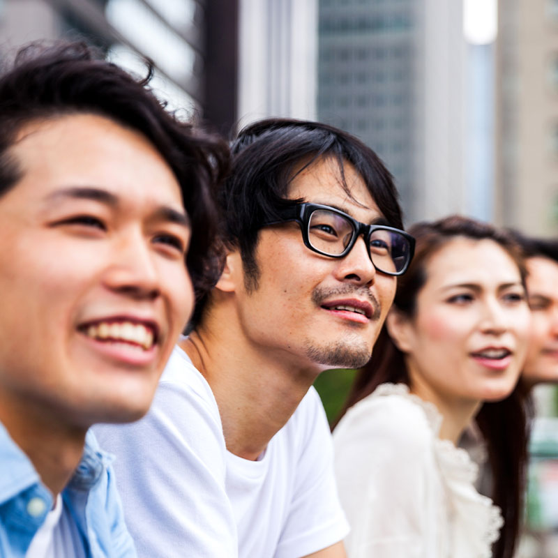 Happy friends smiling outdoors
