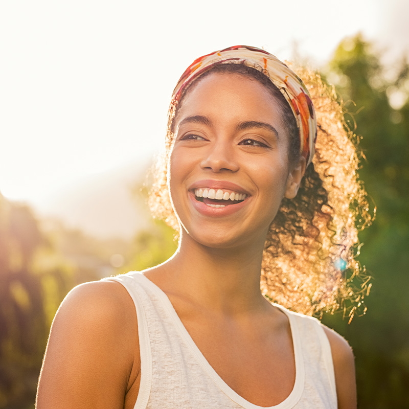Happy woman smiling outdoors