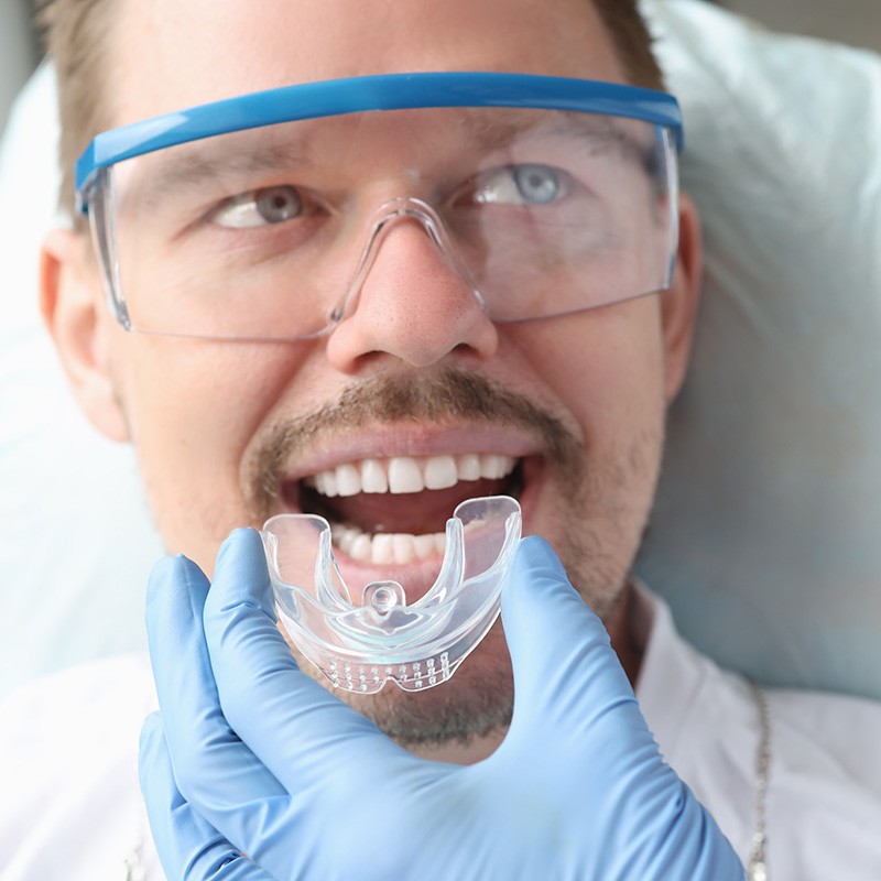 Patient wearing a custom nightguard for teeth protection in Edmonton, AB